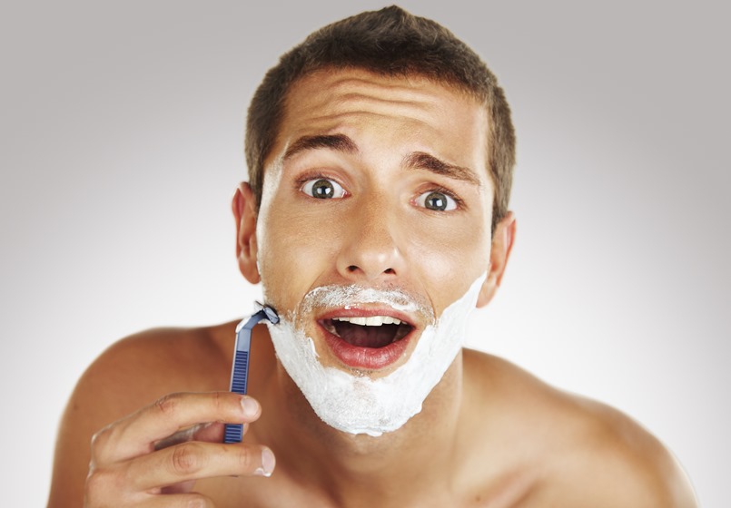 young man shaving in the bath