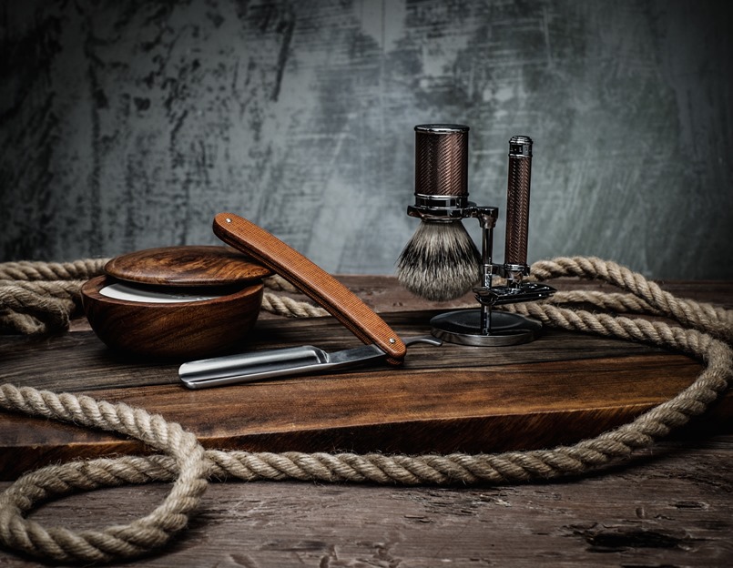 Shaving accessories on a luxury wooden background 